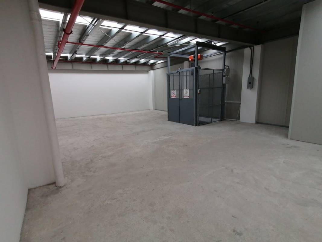 Warehouse empty interior with strong concrete floor and goods elevator Costa del Este