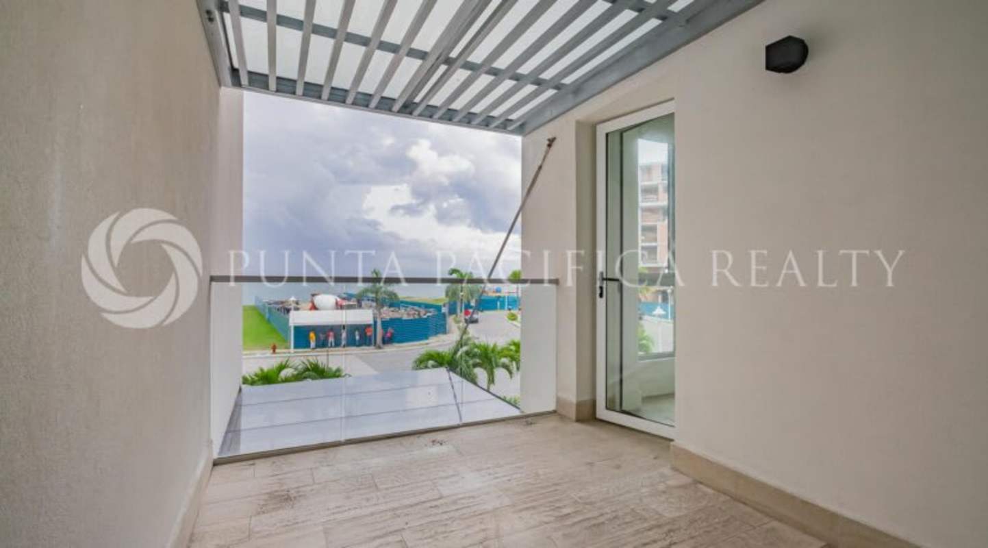 Spacious open-plan living room with floor-to-ceiling glass and marina views at Ocean Reef Beach Club Panama