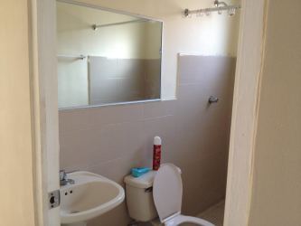 Open kitchen with breakfast counter and overhead cabinets in rental house Costa Verde Panama