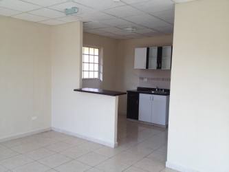 Combined kitchen and dining area with breakfast counter in house for rent Montelimar Panama