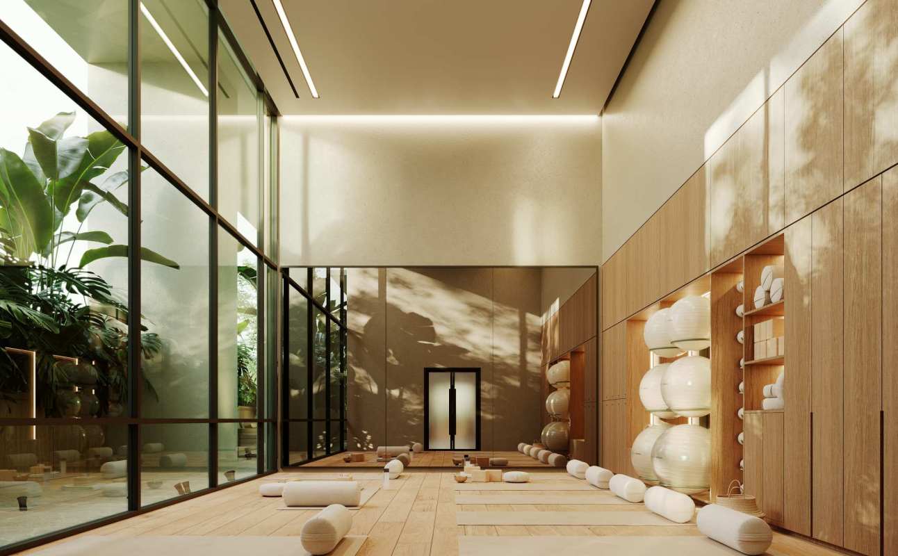 Bright wellness yoga studio with wood panel walls and garden view at PH Blau Panama