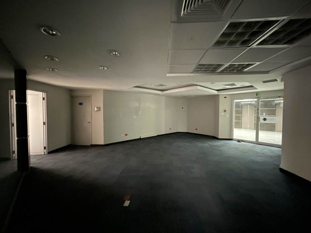 Reception with glass doors and suspended ceiling in Torre Canaima office Panama City