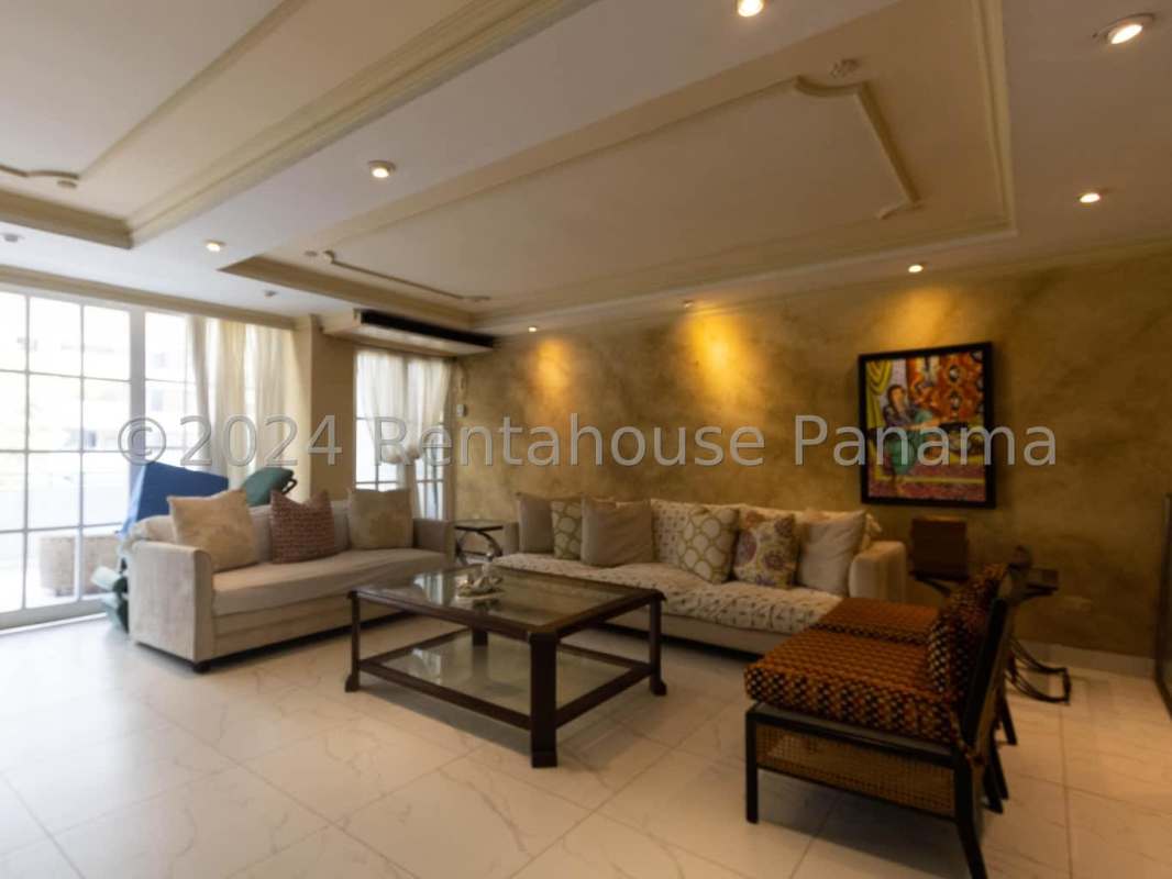 Kitchen with granite countertops and wooden cabinets in PH Paitilla Tower Panama City