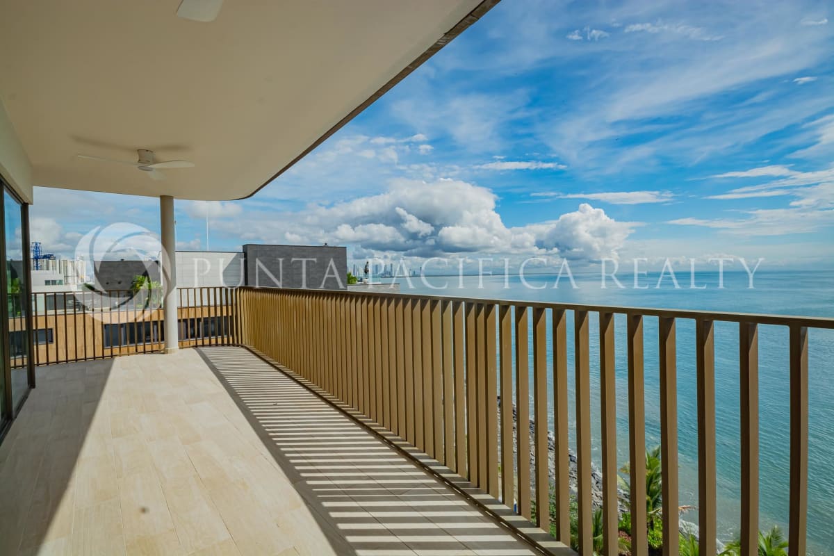 Spacious living and dining room with floor to ceiling windows ocean views Ocean Reef Islands Panama