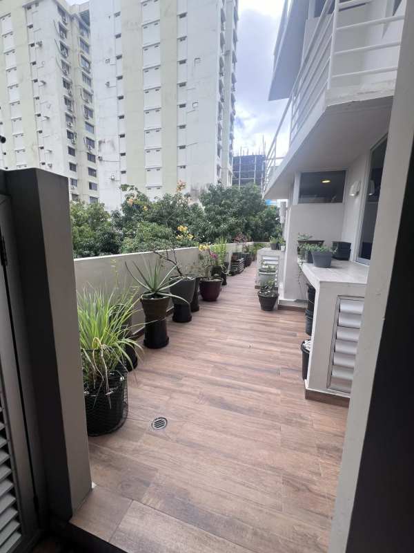 Living room with large window, AC, classic decor, city view in San Francisco Bay Panama