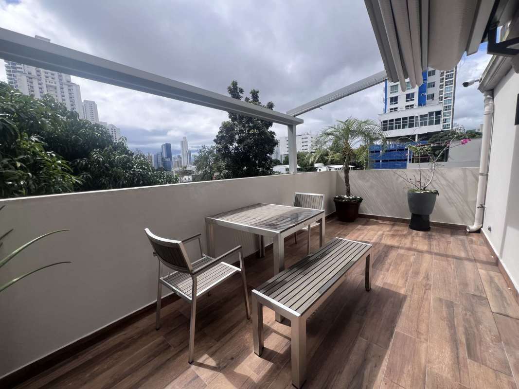 Expansive terrace with pergola, city skyline views, and garden pots San Francisco Bay Panama
