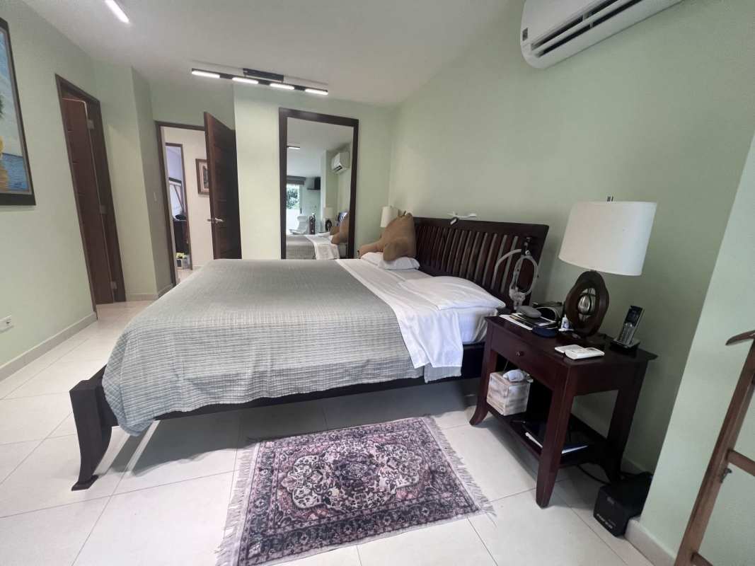 Balcony area with built-in planter, wood-look tile and city skyline view San Francisco Bay