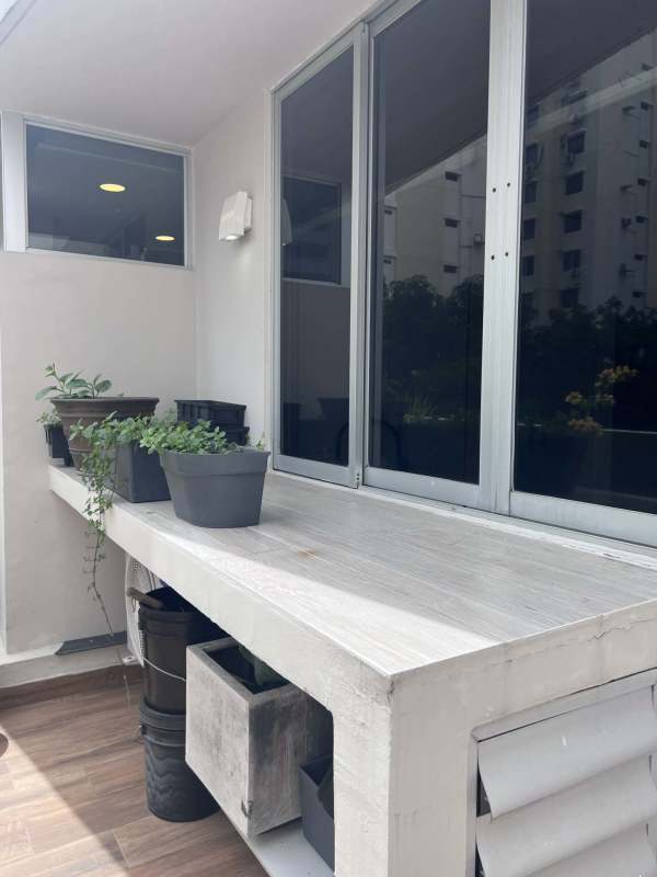 Balcony with sliding glass, garden pots, wood-look tile, San Francisco Bay Panama