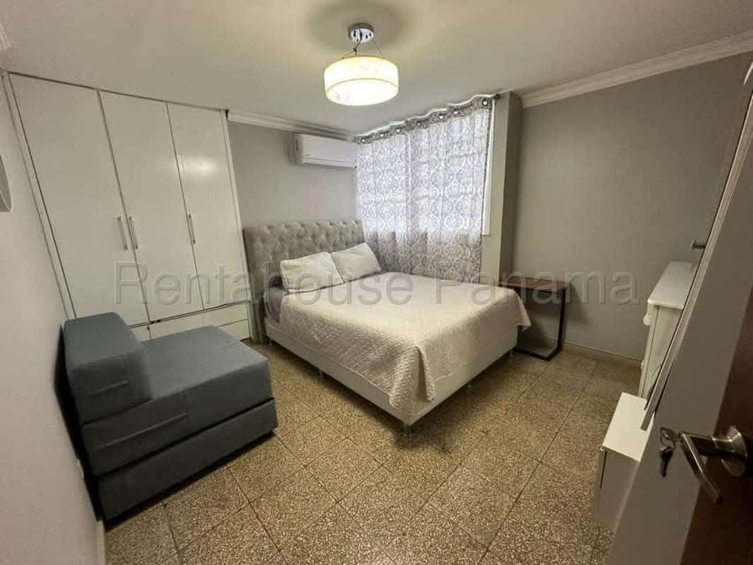 Living space with dining area and open kitchen in Carrasquilla apartment near Parque Omar Panama