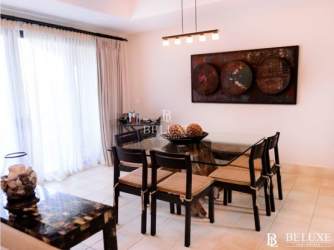 Resort-style swimming pool surrounded by palm trees at Paseo de las Casas Buenaventura Panama