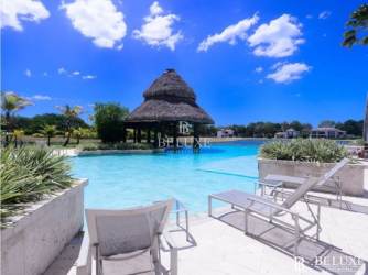 Master bedroom with en-suite bath overlooking gardens Buenaventura Paseo de las Casas luxury condo