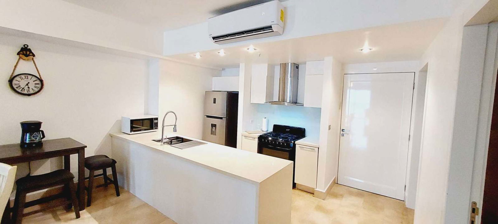 Luxury bedroom with ocean skyline views, marble floors in Yoo Panama Avenida Balboa