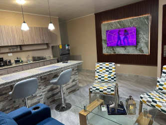 Kitchen area with marble countertops, stove, appliances fully equipped in Villa Dora 2 apartment David Panama