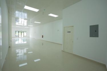 Large open plan commercial interior with glossy tiles glass doors lighting GDP Center La Chorrera