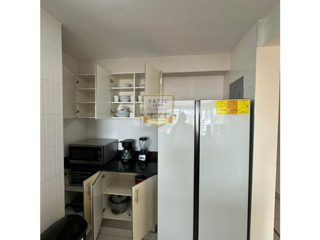 Kitchen with appliances, white cabinets and granite countertop apartment Bella Vista Panama