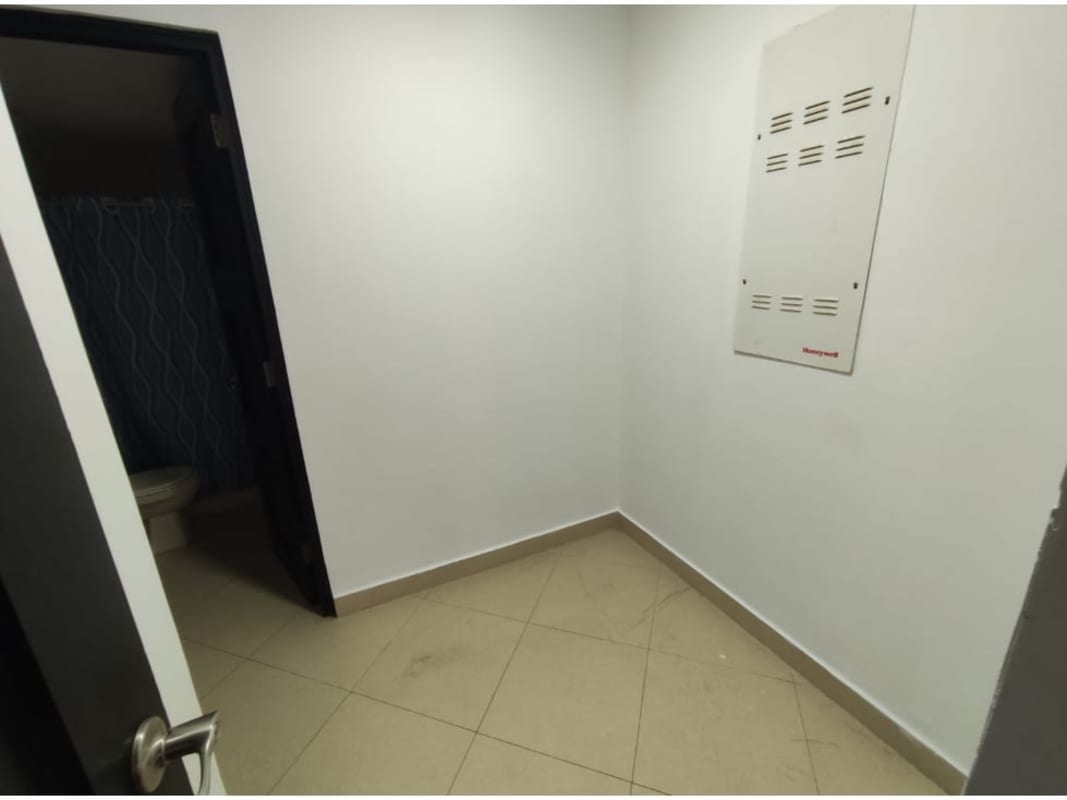 Kitchen with granite counters, breakfast bar and wood cabinets Embassy Club PH Courtyard Panama City