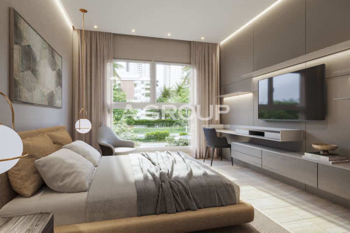 Open-plan dining living room with large windows and garden view in The Woods Santa Maria Panama