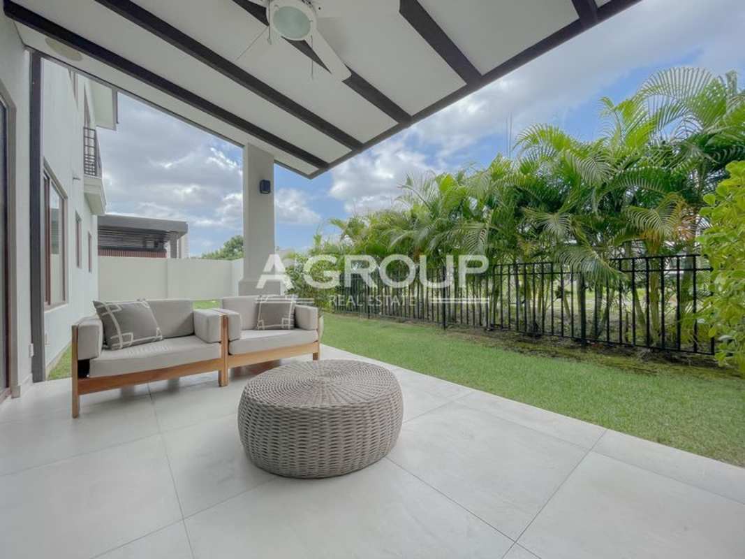 Private outdoor terrace with garden space overlooking golf course at luxury villa The Woods Santa María Panama