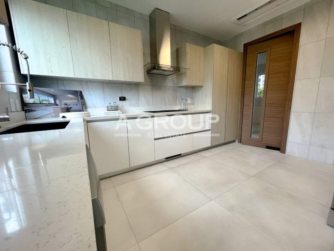 Modern bathroom featuring double vanity, marble accents and walk-in shower in luxury villa Panama