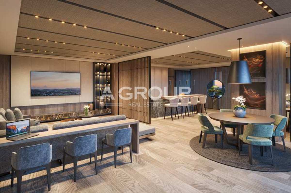 Elegant lobby with greenery, wood panels, portrait art, pendant lights at PH Corotú Santa María Panama