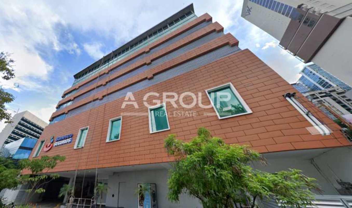 Modern office tower with large windows brick exterior in Marbella Panama