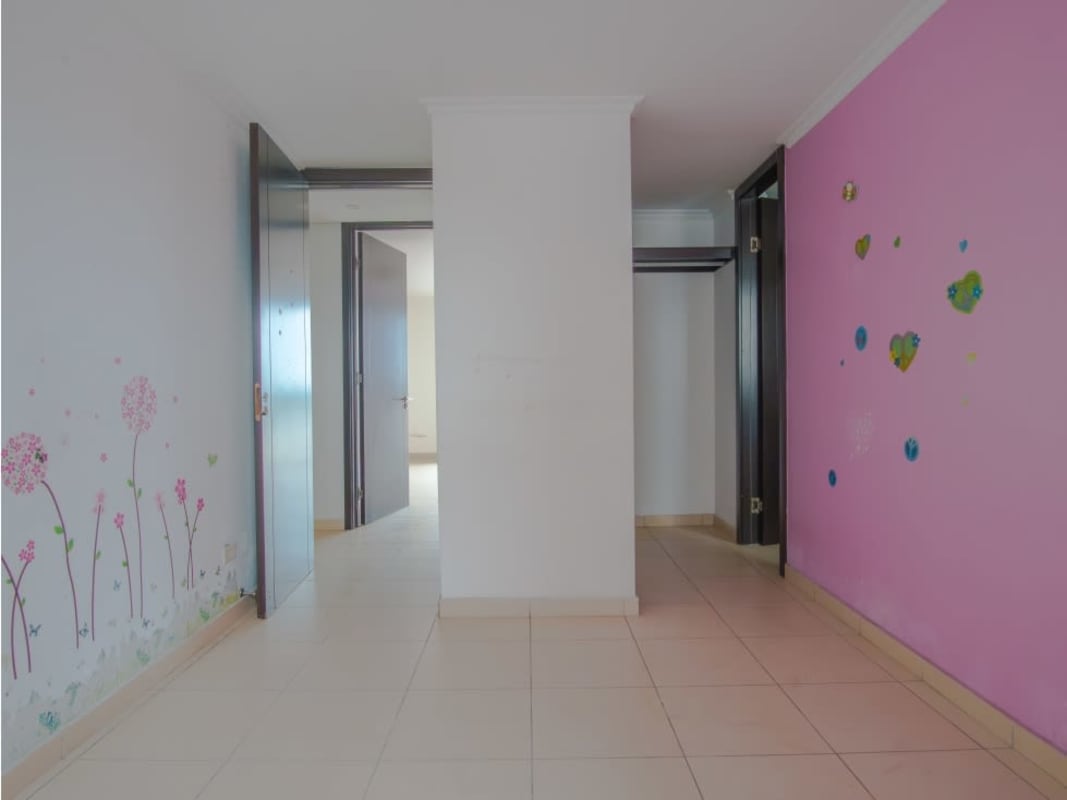 Master bedroom with large window and city view in El Dorado Panama repossessed apartment