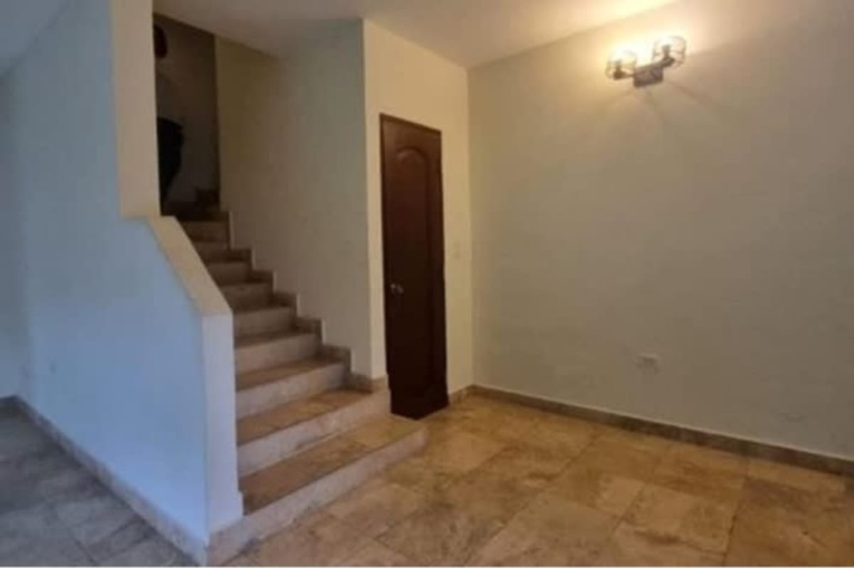 Spacious living room with large windows double-height ceiling Clayton Panama