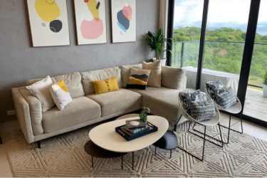 Fully equipped modern kitchen with granite countertops and island in beachfront condo Punta Caelo Panama