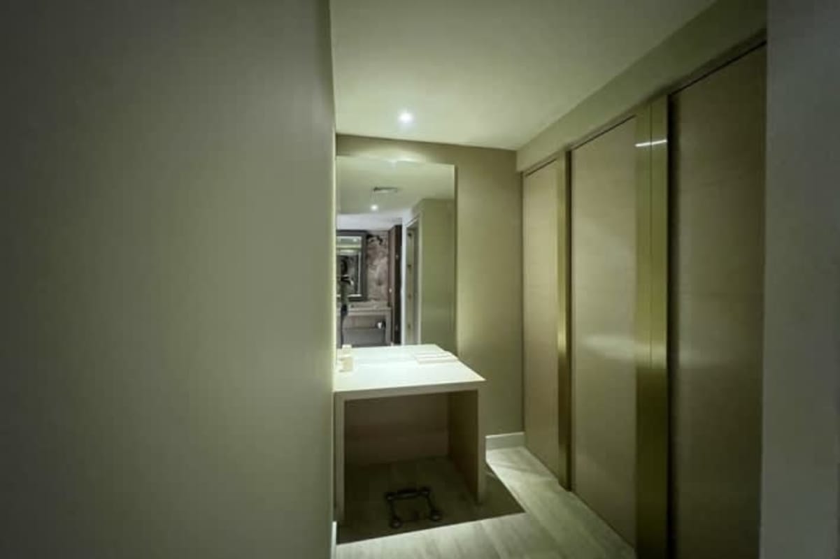 Modern bathroom with glass walk-in shower, stone countertop in PH Waldorf Astoria Panama