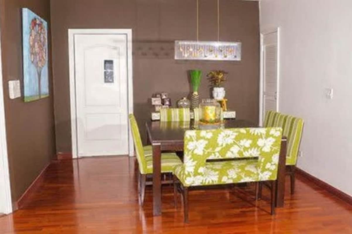 Contemporary dining space with wood floors and pendant lighting luxury house Panama City Altos de Panamá