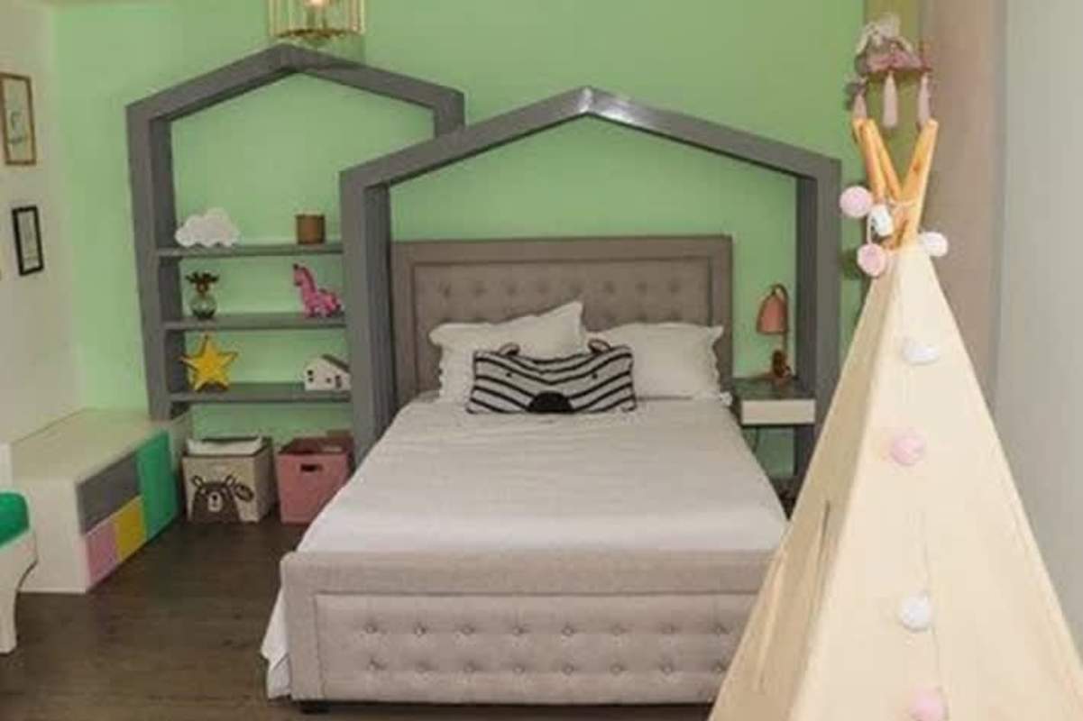 Spacious living room with large glass doors to garden and patio Panama City house