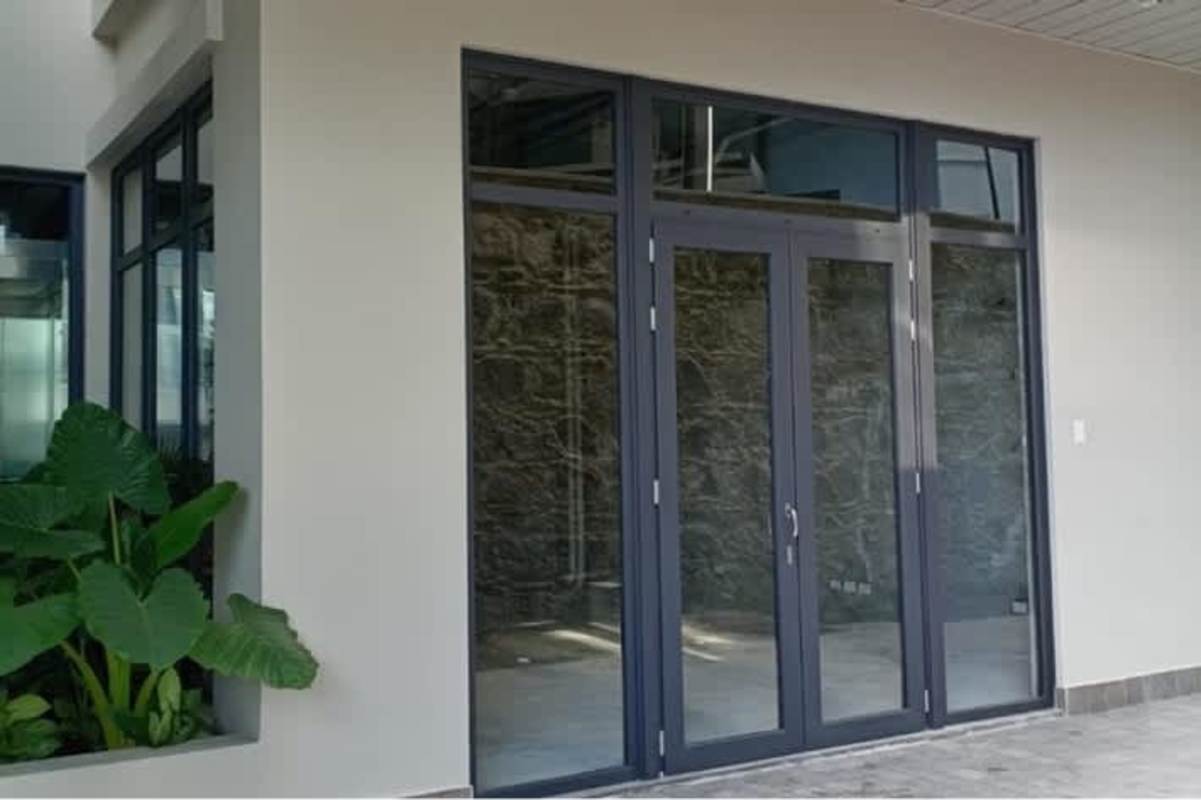 Modern storefront glass doors large windows colonial La Plazuela de Alfaro Casco Viejo Panama