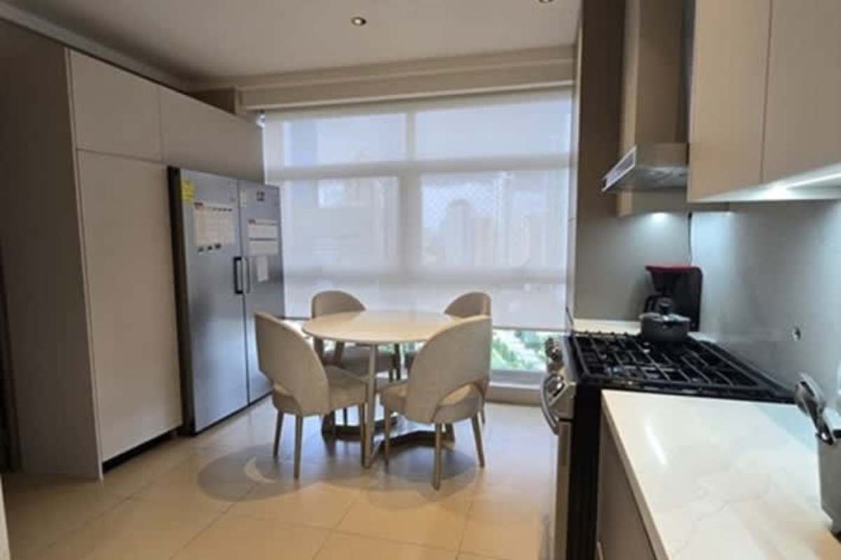 Minimalist hallway with marble pillar, LED lighting and hidden doors at PH Pacific Point Punta Pacífica