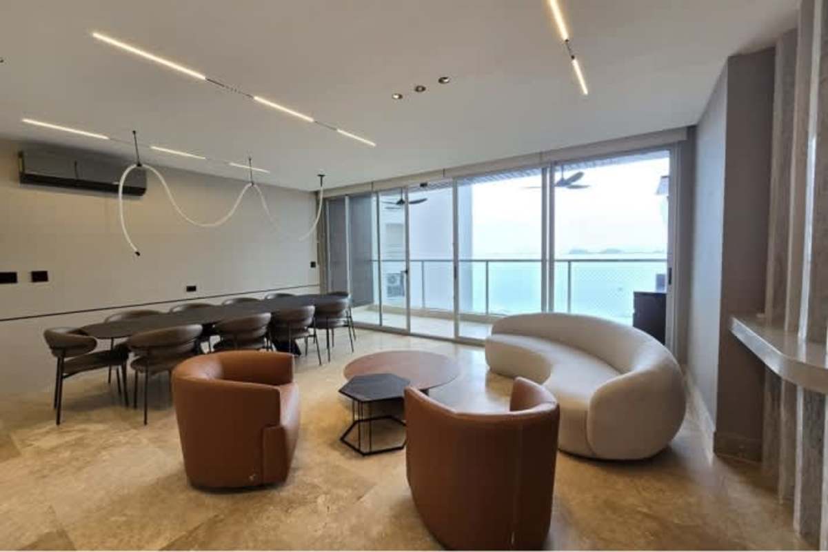 Elegant living dining open space with floor-to-ceiling windows oceanfront balcony PH Pacific Point Panama City