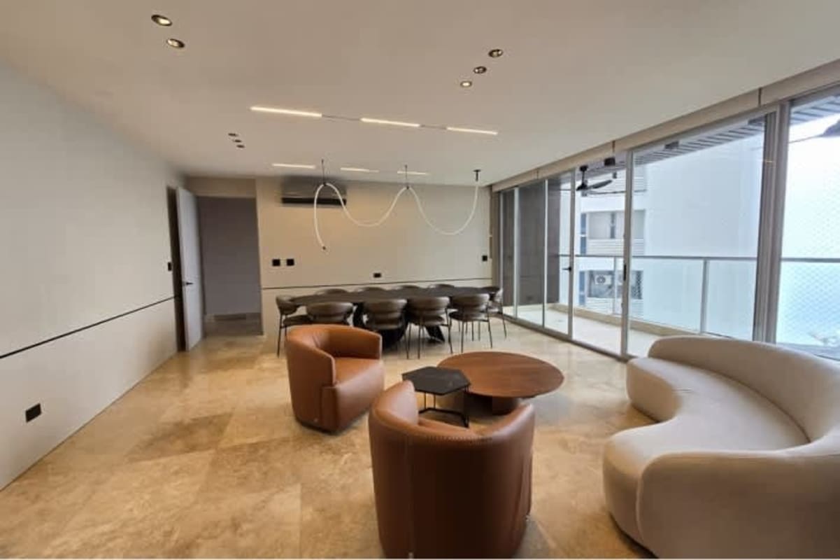 Modern kitchen with granite counters, integrated appliances, large window city views at PH Pacific Point