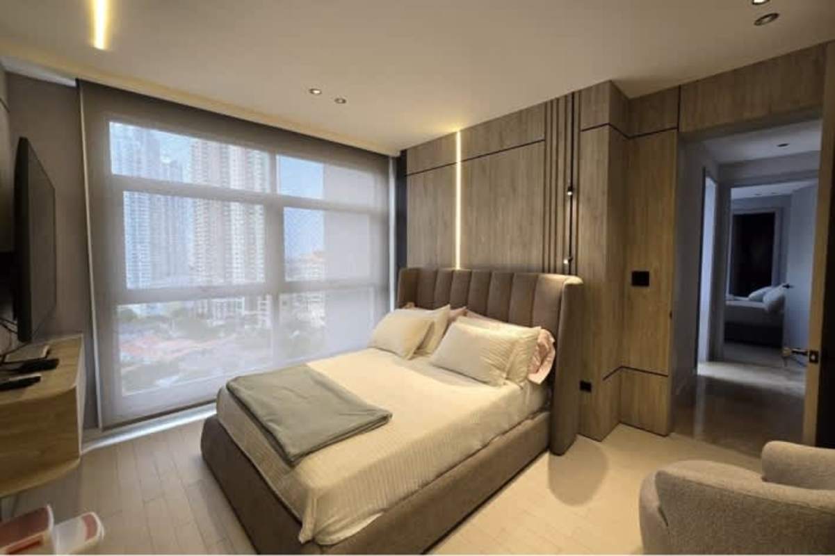 Contemporary bathroom with marble walls vessel sink black faucets PH Pacific Point Punta Pacifica