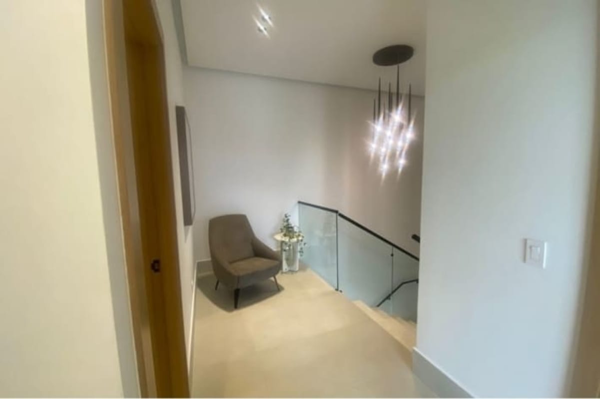 Master bedroom with en-suite bath, golf course views, floor-to-ceiling windows at Santa Maria Panama