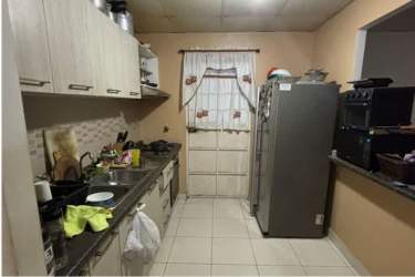 Kitchen with granite countertops and appliances in house for sale Costa Verde Panama
