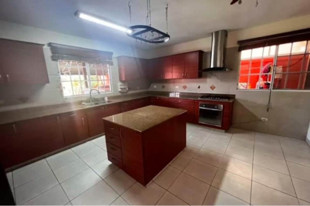 Bedroom with black wardrobe, tiled floors and neutral paint in Campo Lindbergh Panama