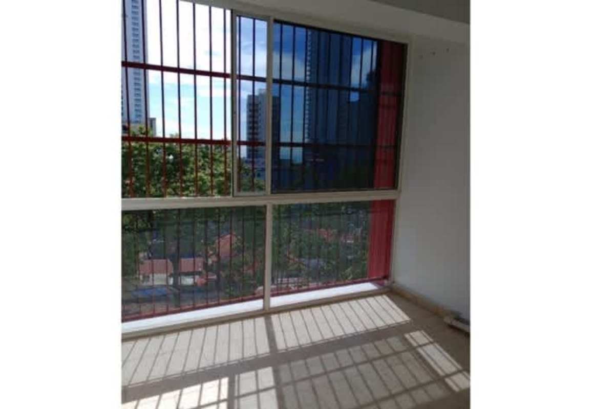 Small kitchen with red mosaic backsplash and cabinets Bella Vista apartment Panama for rent