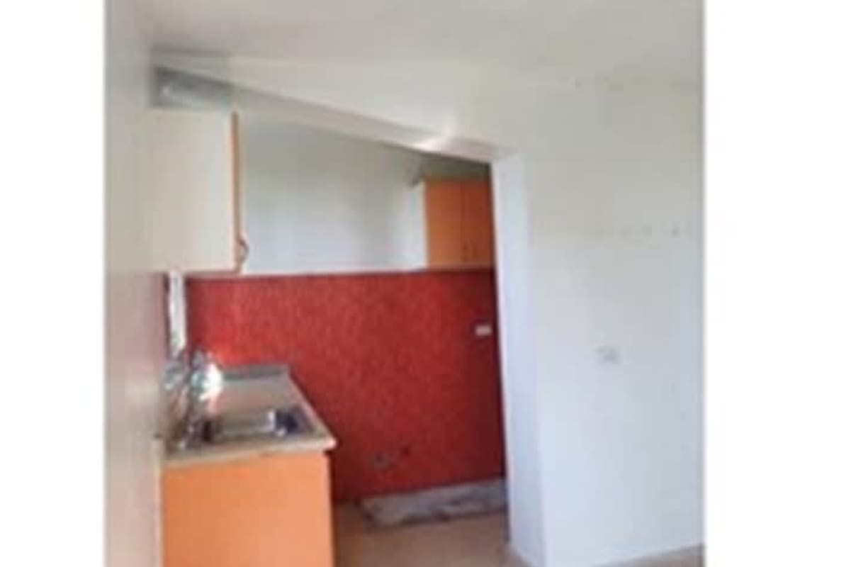 Bright living room with white walls, tiled floor and natural light Bella Vista apartment Panama for rent