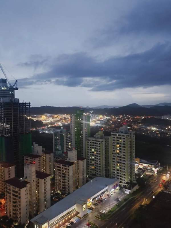 City skyline with mountains in background as seen from PH King Park Panama