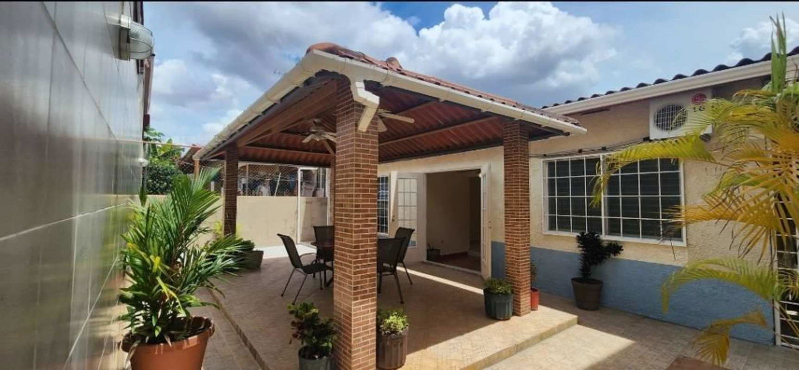 Open living dining area with ceiling fans, tile floor, patio door in PH Quintas de Gratamira Brisas del Golf Panama