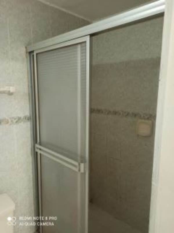 Modern bathroom with walk-in shower tile walls at PH Marbella 47 La Cresta Panama