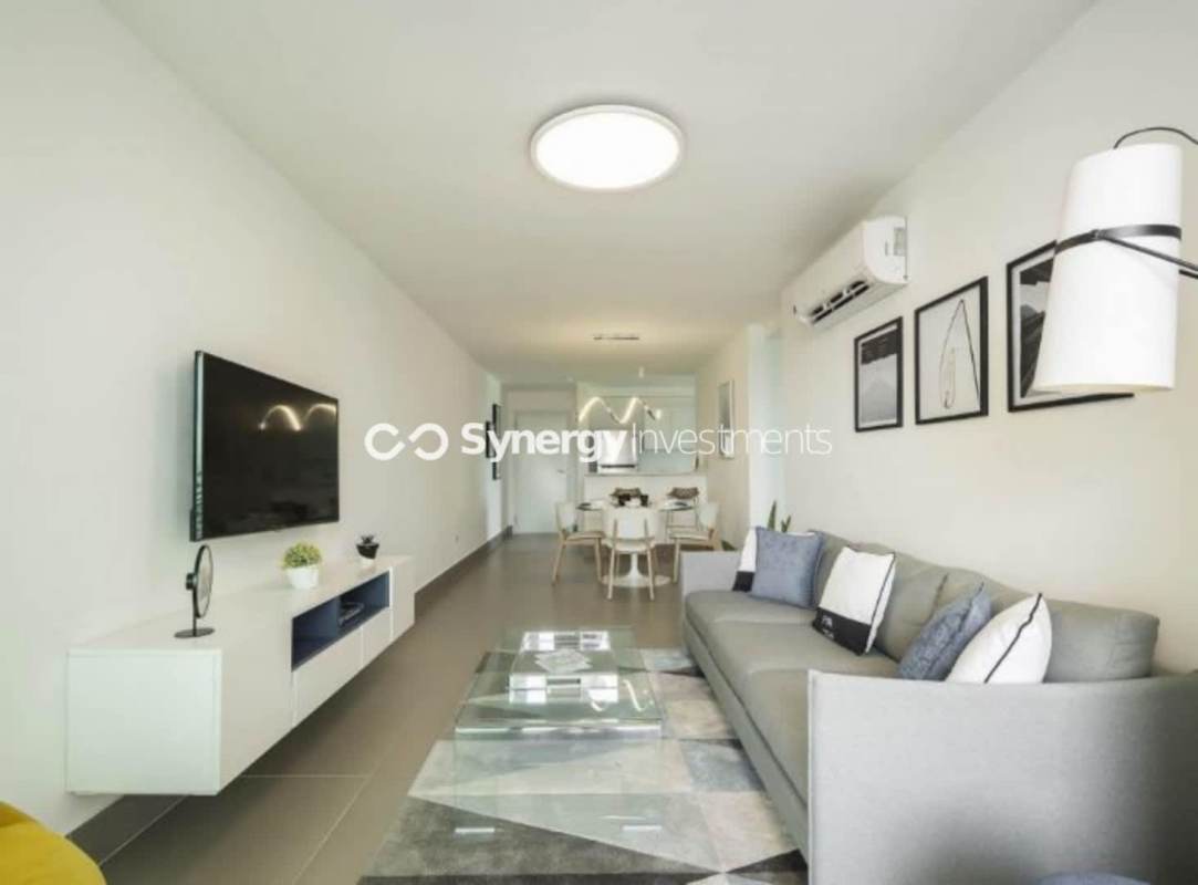 Modern kitchen with white granite countertop and appliances Bella Vista Panama apartment