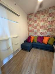 Bedroom with twin beds and smart TV in beachfront apartment Punta Caelo Panama