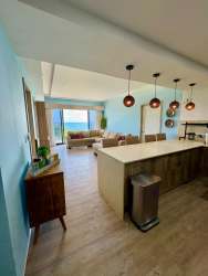 Fully furnished living room with ocean view balcony in Punta Caelo, San Carlos Panama