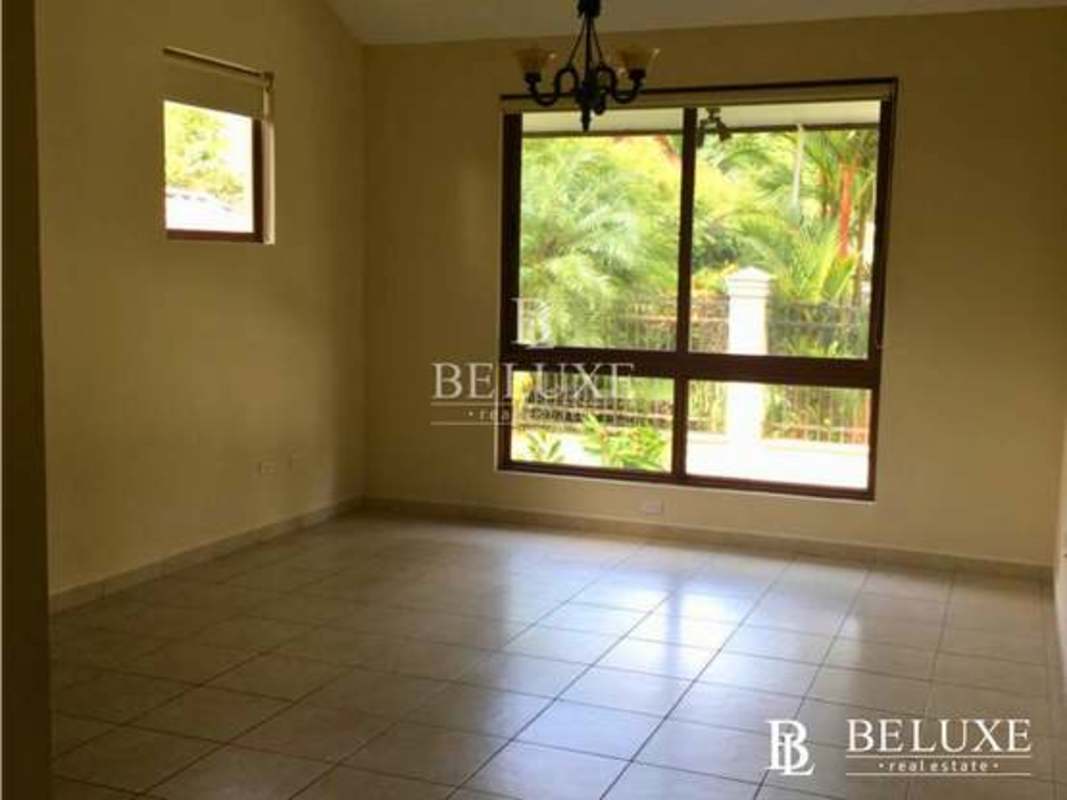Living room with large windows chandelier and ceramic floors Camino de Cruces Panama