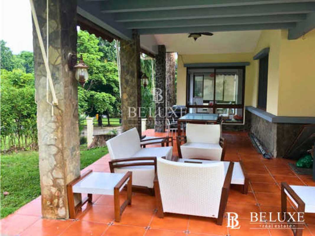 Two levels Mediterranean house with tiled roof and green gardens Camino de Cruces Panama