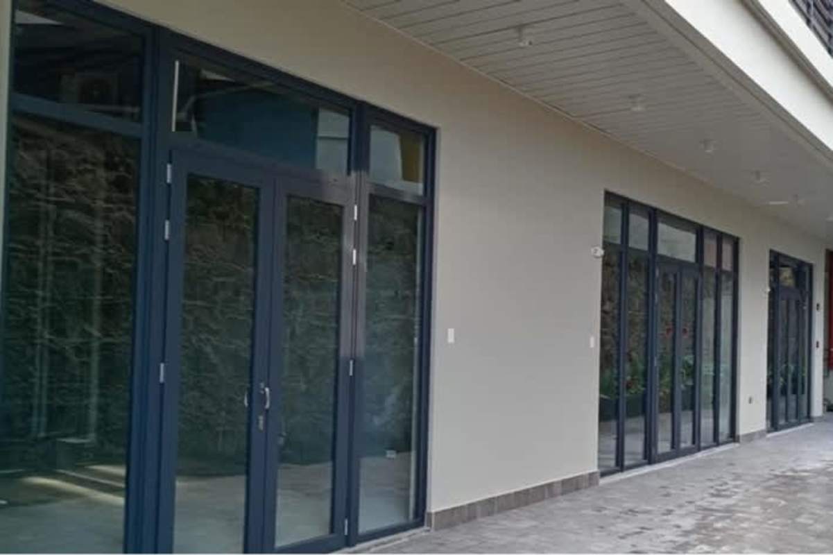 Exterior commercial walkway with glass doors covered modern overhang Casco Viejo